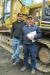 Tyler Zalucki (L) and Jim Zalucki, both of JZ Excavating, Salix, Pa., are thinking about bidding on this Caterpillar 330C excavator.