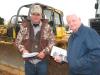 Jonathan Burns (L) of Burns Dirt Construction, Columbus, Miss., and Dale Hollis of Jonathan Burns Enterprises, Columbus, Miss., look over several of the dozers in the auction. 