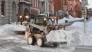 Jerry Jackson/Baltimore Sun photo 
Contractors use Bobcats to remove snow in Baltimore.