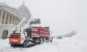 Bill Clark/CQ Roll Call photo
Capitol crews load snow into a dump truck in Washington, D.C.