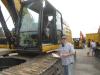 George Zamora of Zamora Construction checks the cab of this Cat 349E excavator.
