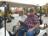 The best way to get around the massive sales site is by golf cart. Earl Modert (L), Modert Excavating, Bronson, Mich., and Steve Smith of Smith Family Farms, Clyde, N.Y.

