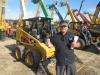 Joe Bailey of Bailey Paving and Billings Asphalt looks over some of the Cat skid steers at the Alex Lyon & Son annual sale. 
