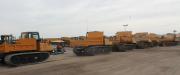 The inventory of track dump trucks (crawlers) are lined up and ready to be auctioned off.