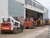All makes and models of skid steers roll over the auction ramp.