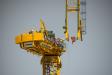 Rudolph and Sletten photo.
Workers assemble the tower crane.
