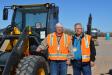 Jerry Jacobson (L), shop superintendent, Elcor Construction, Rochester, Minn. and Steve Paulson, VP of Elcor, are admiring this Deere 304K loader.
