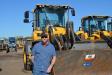 Forest Jeske of Castle Rock Construction traveled from Centennial, Colo., to buy one or more of the many wheel loaders up for sale. Here, he stands by a Volvo L90G.
