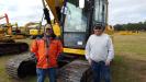 Paul Adams (L) and Henry Dobbelaere are hoping to take an excavator back to Ohio for their construction business.