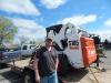 Mac Pautz of Pautz Concrete, Webster, Minn., and a longtime Tri-State Bobcat customer, gets the company’s S185 serviced at the Burnsville open house. 
