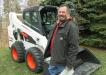 Dominic Bockmore of Bockmore Dairy Farms considers a bid on this Bobcat S530 skid steer loader. 