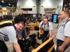 (L-R): The GPlant crew out of Midlands, England, came all the way across the pond to take a look at all the new equipment and services for the concrete industry at WOC 2017. (L-R): Owner Gary Plant with HitchDoc Vice President Chad Mohns; GPlant operators Trevor Bell and Tom Burrows look over this HitchDoc innovative 6 way 96-in. skid steer blade. HitchDoc of Jackson Minn., debuted new innovative attachments at WOC 2017. 