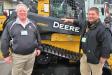 Mark Hash (L) and Eric Bischoff, Murphy Tractor & Equipment, answer attendees’ questions about the dealership’s John Deere machines. 