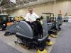 John Braunshausen, government sales, Minnesota Equipment, Rogers, Minn., takes a seat on this Karcher BM250 sweeper scrubber, which is part of the company’s new lineup of Karcher floor care systems. 