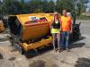 Lynne and Gary Venesky stand in front of their new Mauldin 1750C paver.