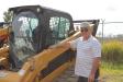 Tad E. Young II, owner of Key II Logging in Skaneateles, N.Y., checks out this Caterpillar skid steer as a potential piece to add to his fleet back home. 