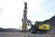 The Atlas Copco PowerROC T45, with telescoping boom, drills precise holes from 3 to 5 inches in diameter.