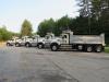 The trucks are lined up and ready for a parade.