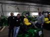 (L-R) David Zachman, operator; Dexter Dehmer, operator and co-owner; and Dan Dehmer, owner, all of Dehmer Landscaping, St. Michael, Minn., take a look at a new John Deere mower.