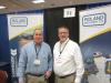 Mike Brunson (L), Roland Machinery, and Mike McCullock, Wirtgen Group, chat at the Roland Machinery booth. 