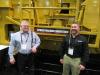 Murrysville Machinery Company’s Sam Stimmel (L) stopped by at the Screen Machine Industries equipment display to speak with Rick Brown about the company’s latest machine introductions.