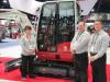 (L-R): Takeuchi’s Tammie Snodgrass, David Caldwell and Dean Hoffman were talking up the company’s E-240 Green Machine compact excavator, which will be launched soon.
