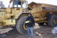 Jesse Andreoff of JSA Services in Buffalo, Minn., stands in front of a ’94 Volvo A35 off-road truck.
