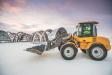 A Volvo wheel loader is used to harvest ice, move snow and ice blocks used for building, as well as clear snow.