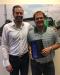 Ryan Puckett (R) from Power Screening, LLC receives the Salesperson of the Year award from Komptech Americas’ Brandon Lapsys.