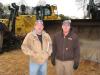 Scott Crowe (L) of Crowe Equipment, Jasonville, Ind., and Wally Sexton of Sexton Equipment Inc. based in Santa Claus, Ind., consider bidding on this Cat D8T dozers.