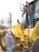 Ed Hallmark (L) and Jerry McLemore of TRAXX Parts & Equipment, Jasper, Ala., climb up on some wheel loaders