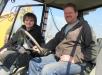 Mackenzie (L) and Scott Brown, both of Brown Farms, Columbus, Ind., check out this Komatsu WB140 backhoe. 