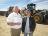 Eric Brosted (L) of Nortrax welcomes Terry Pecha, owner of A-1 Excavating, to the open house.