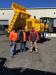 Charles Richardson (R) of Linder goes over the Terramac RT14R, a 14-ton (12.7 t) rotating bed crawler carrier with Barry McKenzie (L) of Kapstone Paper, Charleston, S.C., and Ricky Huneycutt of H&J Contracting in Charleston.