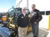 Loren LaGesse (L), Fabick CAT, shows the outside equipment display area to Dean Amys of Amys Excavating.