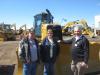(L-R): Jerry and Marilynn Auman, both of J&M Excavating, talk with Mike Lurndal, Fabick CAT, in front of a Cat D6K dozer. 