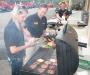 (L-R): Tiffany Rogers, sales; Larry Freeman, Atlanta JCB manager; and Steve Obermeyer, assembly and maintenance technician, man the grill at the event.