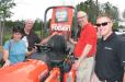 (L-R)): Pat and Andy Wilson, business owners in the Atlanta area, talk with Ken McGuffin, Atlanta Kubota, and Hank Thacker of Kubota Corporation. 