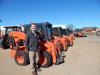 Paul Kroening, regional sales manager, Kubota Fort Worth, Texas, stands with the extensive Kubota product lines available at Lano Equipment.
