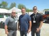 (L-R): Steve Costello, McCann Industries Inc., Tim White, TRW LLC, and Andrew Somers, McCann Industries Inc., have fun at the pig roast and open house. 