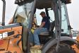 Alvaro Costa, owner of Costa Homes, Upper Southampton, Pa., tries out this Case backhoe before bidding.