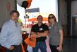 (L-R): William Smith and Billy Hopper of United Rentals talk with Ditch Witch of Arizona owner, Beverly Klingaman.
