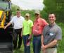 Walsh Equipment’s Tim Gold (L) and Charlie Walsh (R) talk JCB backhoes with Summerhill Township’s Adam Sherman and Bob Arendash.