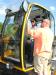 Jeffrey Treynor (L) of Ocean Woods Landscaping, Hilton Head Island, S.C., and Jarred Mayse of CSA in Sea Pines, Hilton Head Island, S.C., check out the cab of the new JCB Hydradig 110w wheeled excavator.