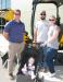 (L-R): Tony Davis, Low Country JCB salesman, talks with Brad and Gina Michalak, both of Michalak Excavating, Guyton, Ga., and the next generation owner, Jace Michalak. 
