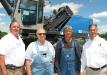 (L-R): John Van, Terex Fuchs, Louisville, Ky., talks with the new owners of this Fuchs MHL370F, Frank Cicatiello and Henry Miller, both of Liberty Recycling, Tuscaloosa, Ala.; and Jeff Dupre, Warrior Tractor.
