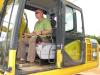 Tim Thomas of Tractor & Equipment Company, Birmingham, Ala., test-operates a Komatsu PC160LC excavator.
