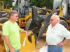 Kip Evans (L) of Kip Evans Logging, Gordo, Ala., and Gene Taylor of Warrior Tractor, Northport, Ala., discuss some of the wheel loaders.