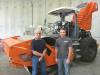 John Hunter (L) and Perry Zach, both of Roland Machinery Co., stand in front of a Hamm H11 ix roller with a Deutz TCD 3.6 liter engine.