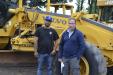 Bobby Bimentel (L) of Bergdoll Construction, Longmeadow, Mass., and Mike Bergdoll, owner of Bergdoll Construction, are interested in this Volvo motorgrader.